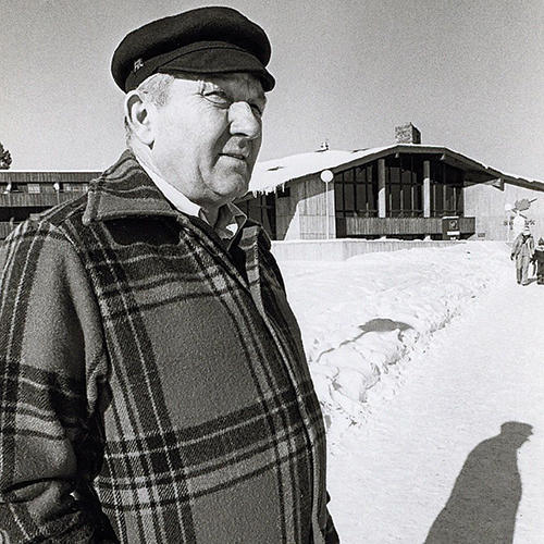 Hayward native Tony Wise shown in this undated photo in front of the Telemark Lodge looks off to the right away from the camera while wearing warm winter clothes for the snowy world around him. He's older, a bit rotund, with a slight squint and frown from the glare off the snow.