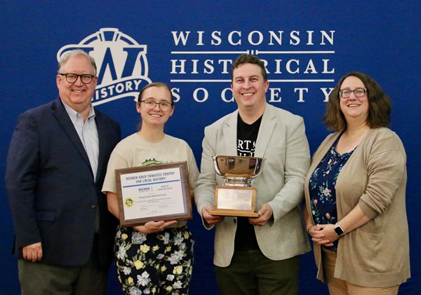 Members of the Portage County Historical Society holding the Reuben Gold Thwaites Trophy for Local History