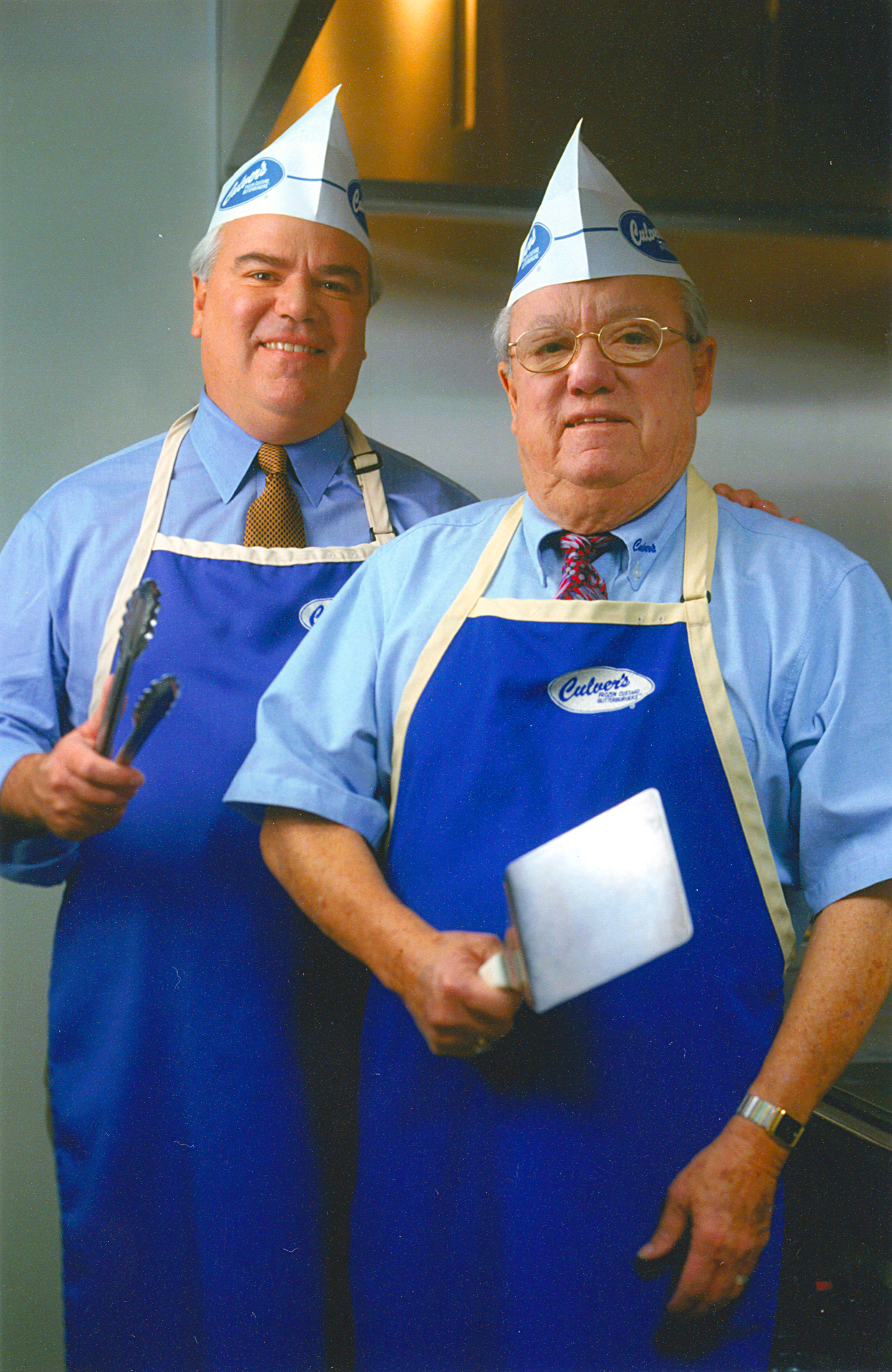 The father and son duo of Craig and George Culver pose for a marketing photo.