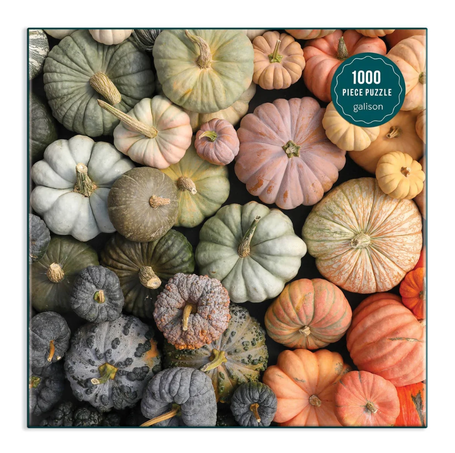a puzzle consisting of multicolored and sized pumpkins all piled up together as viewed from above the pile
