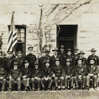 Group portrait outdoors of a group of Civil War veterans with other U.S. military officers.