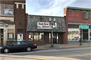 208 Main St., a Commercial Vernacular retail building, built in Black River Falls, Wisconsin in 1912.