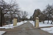 East end of Riverwalk Drive in Grede Park, a NA (unknown or not a building) fence/wall, built in Waukesha, Wisconsin in 1930.