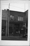 411 W MAIN ST, a Commercial Vernacular small retail building, built in Merrill, Wisconsin in 1900.