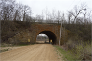 Elroy-Sparta State Trail over Missouri Ave (formerly Eagle Dr), a NA (unknown or not a building) bridge, built in Glendale, Wisconsin in 1880.