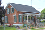 1915 S PERCIVAL ST, a Greek Revival house, built in Hazel Green, Wisconsin in 1850.