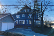 704 Ash Street, a Queen Anne, built in Baraboo, Wisconsin in 1860.