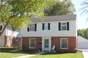 10535 W. Woodward Avenue, a Colonial Revival/Georgian Revival house, built in Wauwatosa, Wisconsin in 1954.