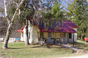 Located on the southwest side of Boice Creek Road, approximately 0.45-mile northwest of the intersection with Kerr Road, a Side Gabled house, built in Lancaster, Wisconsin in 1900.