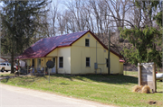 Located on the southwest side of Boice Creek Road, approximately 0.45-mile northwest of the intersection with Kerr Road, a Side Gabled house, built in Lancaster, Wisconsin in 1900.