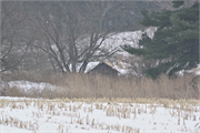 Eastern side of Stockyard Road approximately 0.19-mile northeast of the intersection with Ebenezer Road, a Front Gabled house, built in Wingville, Wisconsin in 1910.