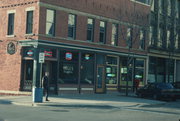 121-123 E MAIN ST, a Romanesque Revival small office building, built in Madison, Wisconsin in 1844.