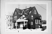 1111 S 8TH ST, a Shingle Style house, built in Manitowoc, Wisconsin in 1895.
