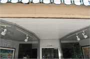 1040 MAIN ST, a Italianate small retail building, built in Stevens Point, Wisconsin in 1883.
