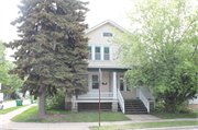 601-603 S ASHLAND AVE, a Dutch Colonial Revival duplex/two-flat, built in Green Bay, Wisconsin in 1905.