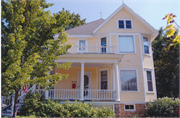 225 N MONROE ST, a Queen Anne house, built in Stoughton, Wisconsin in 1904.