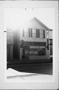 911 WASHINGTON ST, a Italianate small retail building, built in Manitowoc, Wisconsin in 1883.