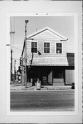 924 WASHINGTON ST, a Greek Revival small office building, built in Manitowoc, Wisconsin in 1865.