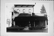 1410 Washington St., a Italianate small retail building, built in Manitowoc, Wisconsin in 1883.