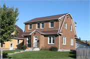 1113 DAY ST (moved from former location at 727 N WEBSTER AVE), a Dutch Colonial Revival house, built in Green Bay, Wisconsin in 1939.