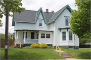 940 N 8TH ST, a Early Gothic Revival house, built in Manitowoc, Wisconsin in 1860.