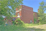 7230 7 Mile Rd, a Neoclassical/Beaux Arts one to six room school, built in Raymond, Wisconsin in 1929.