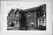 1424 NEWBERRY AVE/1421 MAIN ST, a Colonial Revival/Georgian Revival house, built in Marinette, Wisconsin in 1921.