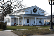 118 W STATE ST, a Greek Revival house, built in Fox Lake, Wisconsin in 1850.