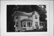 NW CORNER OF SPRING ST AND RAILROAD TRACKS, a Gabled Ell house, built in Neshkoro, Wisconsin in .