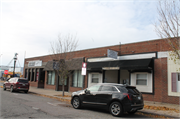 134 S Walnut St, a Commercial Vernacular retail building, built in Reedsburg, Wisconsin in 1925.