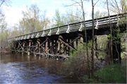 Oconto River State Trail over Little River, a NA (unknown or not a building) wood bridge, built in Stiles, Wisconsin in 1882.