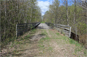 Oconto River State Trail over Little River, a NA (unknown or not a building) wood bridge, built in Stiles, Wisconsin in 1882.