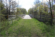 Oconto River State Trail over Little River, a NA (unknown or not a building) wood bridge, built in Stiles, Wisconsin in 1882.