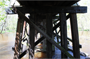 Oconto River State Trail over Little River, a NA (unknown or not a building) wood bridge, built in Stiles, Wisconsin in 1882.