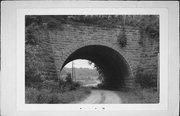 Elroy-Sparta State Trail over Missouri Ave (formerly Eagle Dr), a NA (unknown or not a building) bridge, built in Glendale, Wisconsin in 1880.