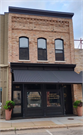 1040 MAIN ST, a Italianate small retail building, built in Stevens Point, Wisconsin in 1883.