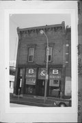 117 E OAK ST, a Italianate small retail building, built in Sparta, Wisconsin in 1890.
