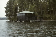 9276 HOWARD'S POINT RD ON LAKE MINOCQUA, a Craftsman boat house, built in Minocqua, Wisconsin in 1920.