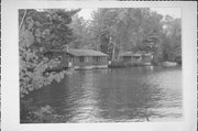 ON DEER LAKE NEAR STATE HIGHWAY 32, a Contemporary boat house, built in Three Lakes, Wisconsin in 1950.