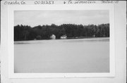 ON LAKE MINOCQUA, 2 MI S OF COUNTY HIGHWAY J, a Queen Anne boat house, built in Minocqua, Wisconsin in 1915.