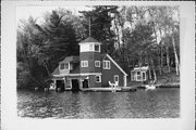9512 COUNTRY CLUB RD ON LAKE MINOCQUA 9512 COUNTRY CLUB RD ON LAKE MINOCQUA, a Queen Anne boat house, built in Minocqua, Wisconsin in 1913.