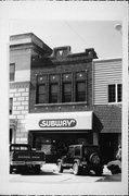 15 N BROWN ST, a Commercial Vernacular small retail building, built in Rhinelander, Wisconsin in 1914.