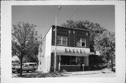 151 N BROWN ST, a Commercial Vernacular small retail building, built in Rhinelander, Wisconsin in 1921.