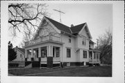 254-256 W CHESTNUT ST, a Queen Anne house, built in Port Washington, Wisconsin in 1900.