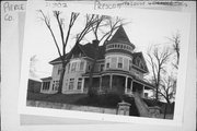 LOCUST ST, 140, AT ORANGE ST, NE CNR, a Queen Anne lodging-hotel, built in Prescott, Wisconsin in 1907.