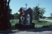 COUNTY HIGHWAY B AND COUNTY HIGHWAY K, a Cross Gabled roadside chapel, built in Stockton, Wisconsin in .