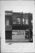 1319 3RD ST, a Romanesque Revival small retail building, built in Stevens Point, Wisconsin in 1890.