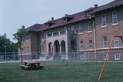 21425 SPRING ST, a Romanesque Revival dormitory, built in Dover, Wisconsin in 1922.