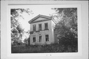 1909 WAUKESHA RD, a Greek Revival house, built in Raymond, Wisconsin in 1845.