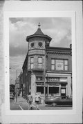 100-112 E CHESTNUT ST, a Queen Anne retail building, built in Burlington, Wisconsin in 1895.